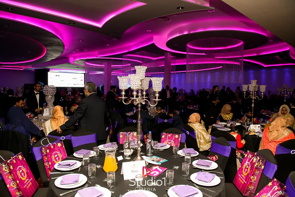 Guests at a dinner table in the ballroom