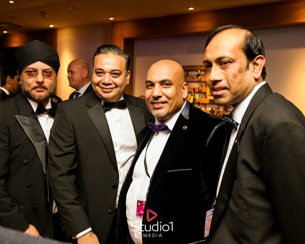 Winners in black tie on stage